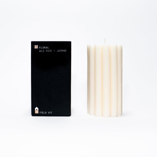 This is a white candles and candle holders by Powered By People called floral pillar candle in standard
