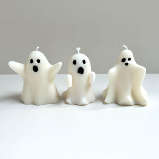 This is a white candles and candle holders by Over By The Moon called white ghost candle set in standard