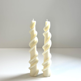 This is a white candles and candle holders by Over By The Moon called white ribbon taper set in standard