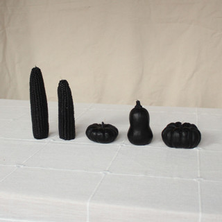 This is a black candles and candle holders by Happy Organics called blackberry - harvest table bundle beeswax candles in standard
