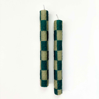 This is a green candles and candle holders by Annie Shapiro called checkered taper candles (green & moss) in standard
