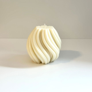 This is a white candles and candle holders by Over By The Moon called large white swirl candle in standard