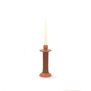 This is a orange candles and candle holders by Powered By People called handcrafted leather-wrapped candle holder - moroccan artisan design - brown/medium in standard