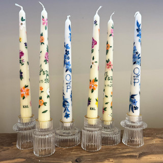 This is a multicolorassorted-colors candles and candle holders by Ashley Myers called fully custom hand-painted taper candles, set of 2 in standard