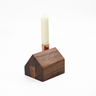 This is a brown candles and candle holders by Ann Nygard called saltbox in standard