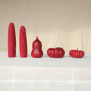 This is a red candles and candle holders by Happy Organics called pomegranate - harvest table bundle beeswax candles in standard