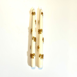 This is a multicolor candles and candle holders by Over By The Moon called white and gold ribbon tapers in standard