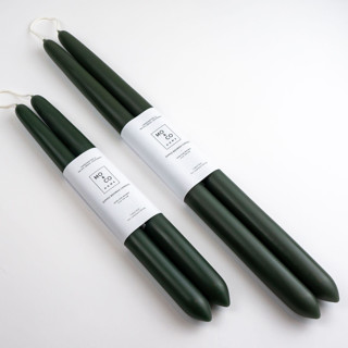 This is a green candles and candle holders by MoAndCo Home called 14 inch, forest green, dipped beeswax taper candles in standard