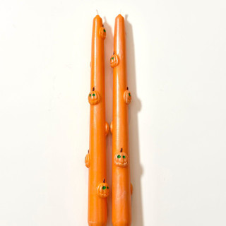 This is a orange candles and candle holders by Over By The Moon called orange pumpkin taper set in standard