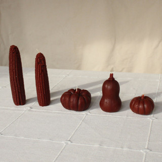 This is a brown candles and candle holders by Happy Organics called chestnut - harvest table bundle beeswax candles in standard