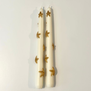 This is a multicolor candles and candle holders by Over By The Moon called white and gold star tapers in standard