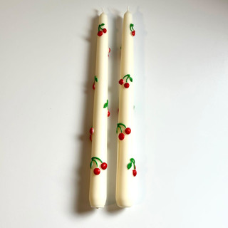 This is a multicolor candles and candle holders by Over By The Moon called white cherry taper set in standard