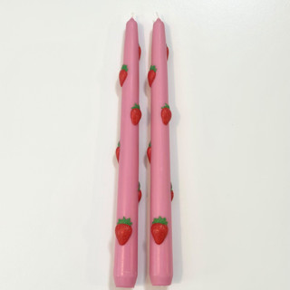 This is a multicolor candles and candle holders by Over By The Moon called pink strawberry tapers in standard