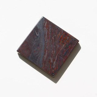 This is a red decorative objects by the parmatile shop called marble pedestal (iron red) in standard