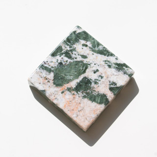 This is a orange decorative objects by the parmatile shop called marble pedestal (peach grains) in standard