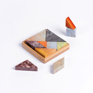 This is a multicolor decorative objects by Powered By People called colorful gemstone tangram puzzle in standard