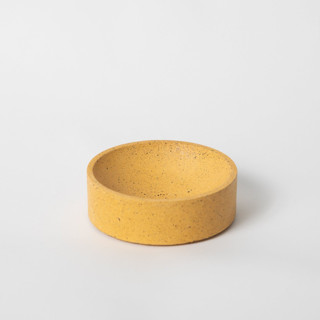 This is a yellow decorative objects by Pretti.Cool called 4" catch-all: marigold terrazzo in standard