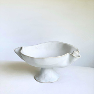This is a white decorative objects by Cloude Made called hand sculpted pedestal bowl no. 2 in standard