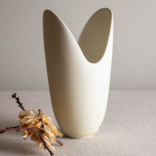 This is a white decorative objects by Lisa Fleming called crystalline white matte glazed vessel with carved rim in standard