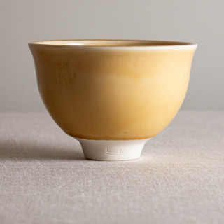 This is a yellow decorative objects by Lisa Fleming called butterscotch glazed vessel with flared rim in standard