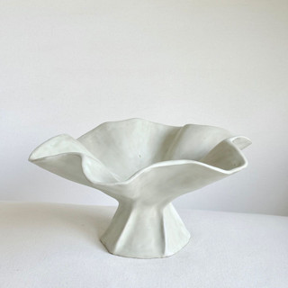 This is a white decorative objects by Cloude Made called antique white cascading pedestal bowl in standard