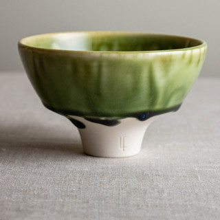 This is a green decorative objects by Lisa Fleming called mirror green glazed vessel 2 in standard