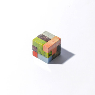 This is a multicolor decorative objects by Powered By People called gemstone soma cube puzzle in standard