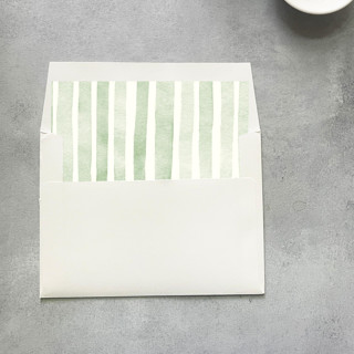 This is a green wedding envelopes by Cotton and Bow called green stripe watercolor envelope liner | set of 10 in standard