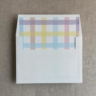 This is a multicolorassorted-colors wedding envelopes by Ivory Invitations called marshmallow checkers envelope liner for a7 square flap envelope | pack of 10 in standard