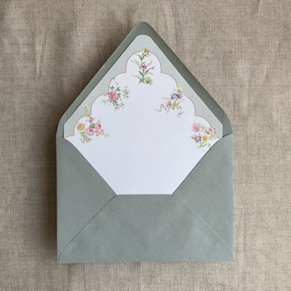 This is a green wedding envelopes by Ivory Invitations called clara green scallop floral edge printed envelope liner for a7 euro flap envelope | pack of 10 in standard