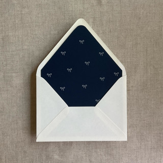 This is a blue wedding envelopes by Ivory Invitations called navy baby ribbon bows envelope liner for a7 euro flap envelope | pack of 10 in standard