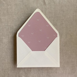 This is a pink wedding envelopes by Ivory Invitations called old rose baby ribbon bows envelope liner for a7 euro flap envelope | pack of 10 in standard