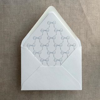 This is a blue wedding envelopes by Ivory Invitations called steel blue ribbon bows printed envelope liner for a7 euro flap envelope  | pack of 10 in standard