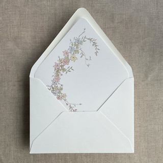 This is a multicolor wedding envelopes by Ivory Invitations called marianne's bouquet floral printed soft white liner for a7 euro flap envelope | pack of 10 in standard
