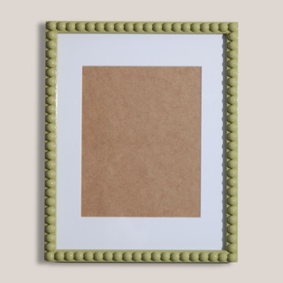 This is a green accent pieces by Lily Field Studio called matcha beaded frame with white mat in standard