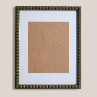 This is a green accent pieces by Lily Field Studio called thyme beaded frame with white mat in standard