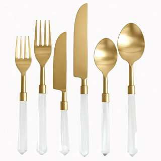 This is a clear tableware by borrowed BLU called prism flatware // 6 piece set in clear + gold in standard