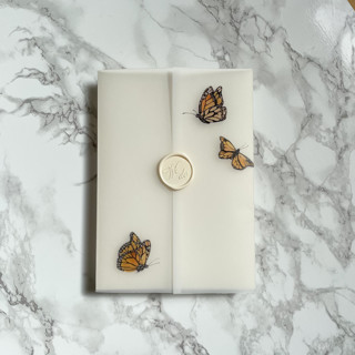 This is a clear vellum wedding invitations by Carley Zuercher called monarch butterfly vellum jackets (10 pack) in standard