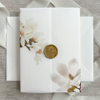 This is a white vellum wedding invitations by Maria Ferrer G. called magnolia vellum jackets for invitations | set of 10 in standard