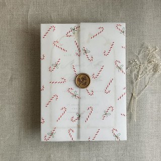This is a multicolorassorted-colors vellum wedding invitations by Ivory Invitations called holiday candy cane printed vellum wrap for 5x7 card | pack of 10 in standard