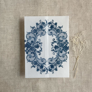 This is a blue vellum wedding invitations by Ivory Invitations called navy la belle rose lace printed vellum wrap for 5x7 card  | pack of 10 in standard