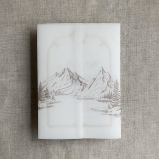This is a beige vellum wedding invitations by Ivory Invitations called cashmere mountain sketch printed vellum wrap for 5x7 card | pack of 10 in standard