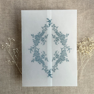 This is a blue vellum wedding invitations by Ivory Invitations called steel blue print french floral crest vellum wrap for 5x7 card | pack of 10 in standard