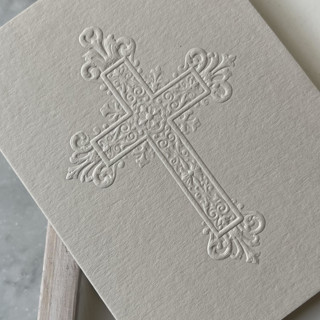 This is a gray vellum wedding invitations by Christopher Neubauer called outer program cover with sculpt embossed cross | set of 50 in standard