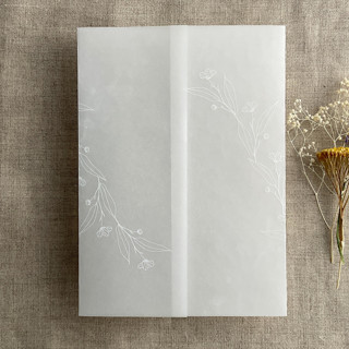 This is a white vellum wedding invitations by Ivory Invitations called jessica white ink print minimalist flowers vellum wrap for 5x7 card | pack of 10 in standard