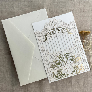 This is a white vellum wedding invitations by Ivory Invitations called ivory castle gate lasercut jacket for 5x7 inch invitation | pack of 10 | envelopes included in standard