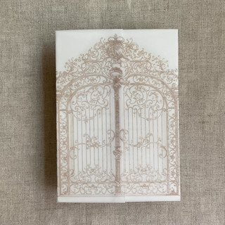 This is a beige vellum wedding invitations by Ivory Invitations called cashmere vintage arched gate printed vellum wrap for 5x7 card | pack of 10 in standard