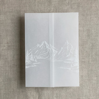 This is a white vellum wedding invitations by Ivory Invitations called white ink mountain sketch printed vellum wrap for 5x7 card | pack of 10 in standard
