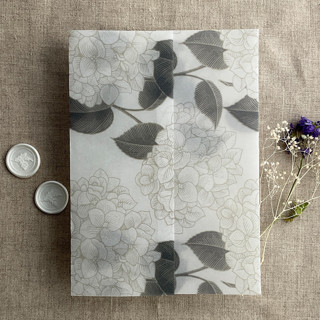 This is a gray vellum wedding invitations by Ivory Invitations called antique hydrangea flower slate leaf printed vellum wrap for 5x7 card | pack of 10 in standard