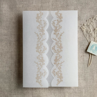 This is a gold vellum wedding invitations by Ivory Invitations called gold floral printed scallop edge vellum wrap for 5x7 card | pack of 10 in standard
